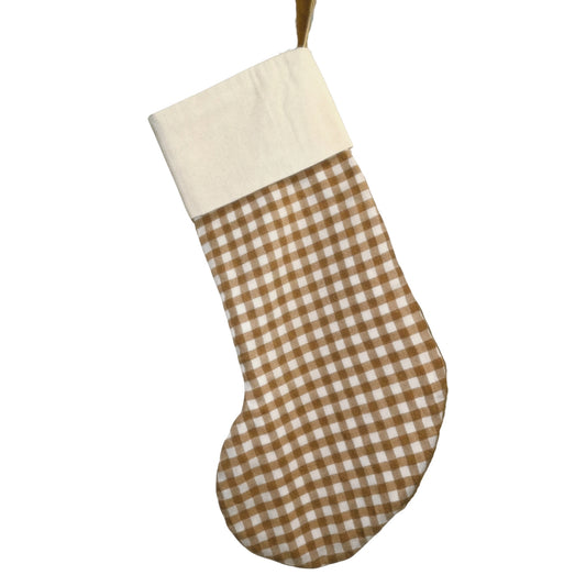 Brown and white checkered Christmas stocking on a white background